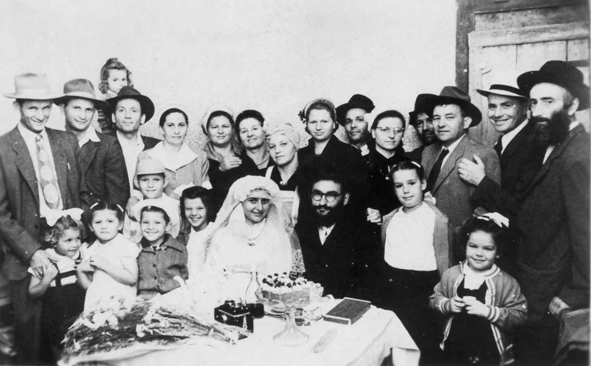  1952 Duvid Visel Wedding–Loft to Right. David and Yosef Kochavi, Meir and Elka Stern, Aunt Zisel, my mother, Maita Vizel, Ruchel and Yankel Visel, Golda Shalita My father Uncle Moshe Veig. Bottom row ?, Sara Stern, Me, Shlomo and Tmima Shalita Choson Duvid Visel and Kalah, Chana and Raaya Veig. 