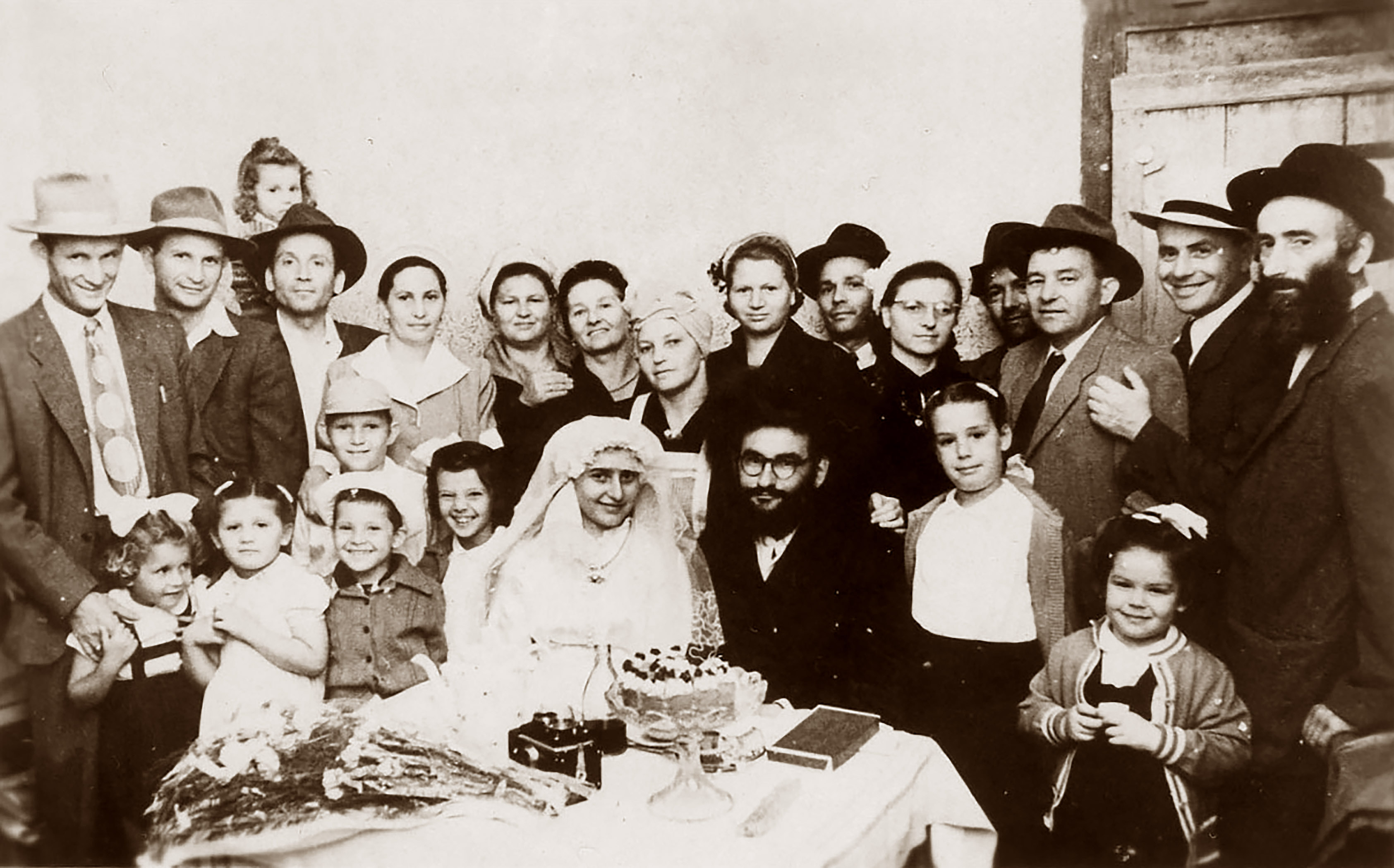  1952 Duvid Visel Wedding–Loft to Right. David and Yosef Kochavi, Meir and Elka Stern, Aunt Zisel, my mother, Maita Vizel, Ruchel and Yankel Visel, Golda Shalita My father Uncle Moshe Veig. Bottom row ?, Sara Stern, Me, Shlomo and Tmima Shalita Choson Duvid Visel and Kalah, Chana and Raaya Veig. 